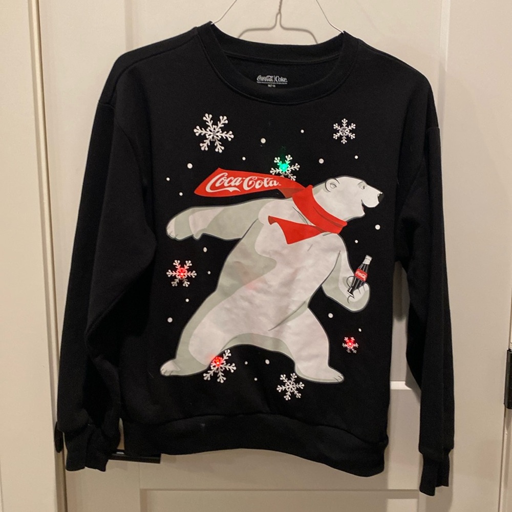 Coca Cola Bear Sweatshirt.  Lights up red and green flashes.‎  Black.